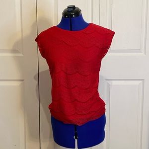 Red dress shirt with a lace covering.